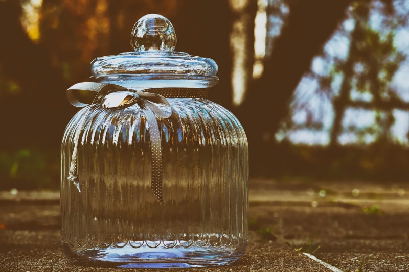 Glass jar outside in nature. how to store human ashes